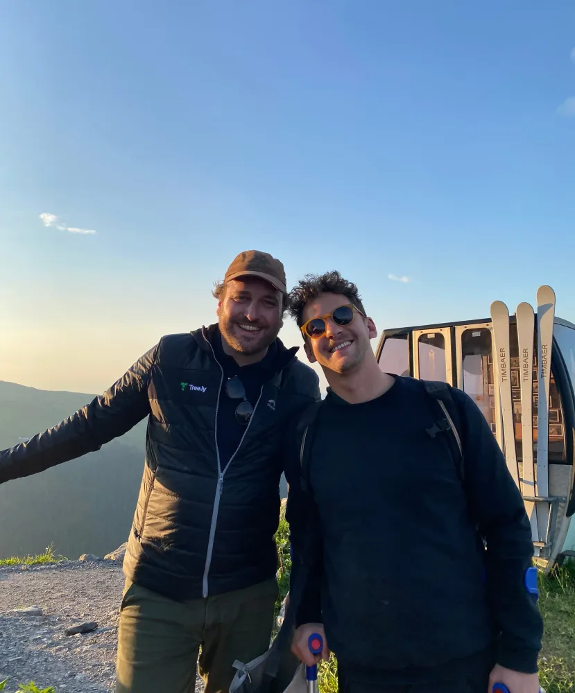 two men standing on the mountain