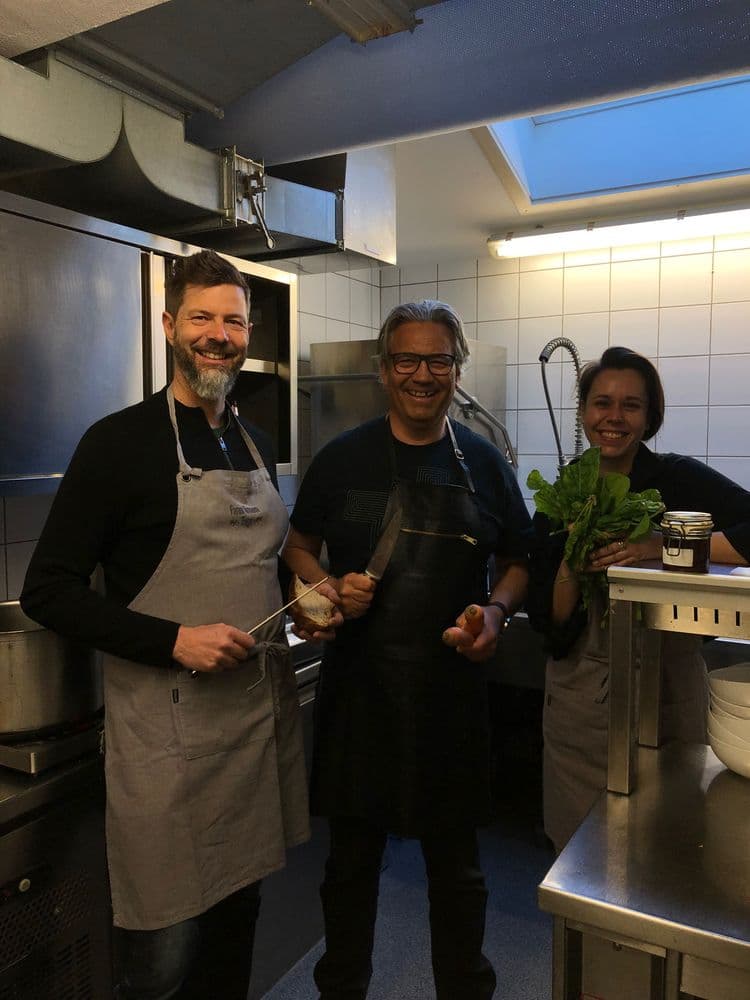 people standing in the kitchen